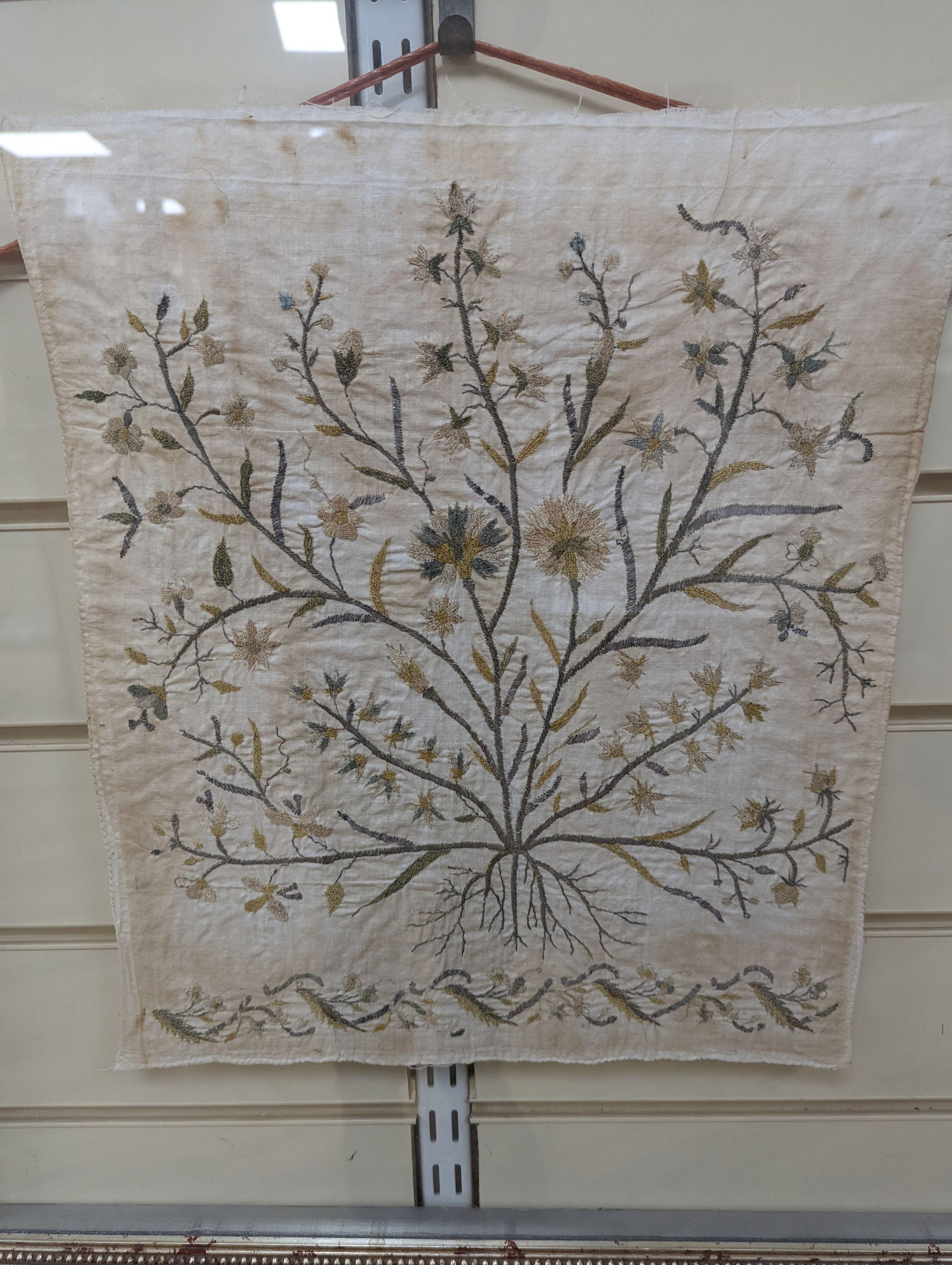 A pair of framed, silver and gold thread floral embroidered Turkish towel ends, 39 x 35cm excl. frame.